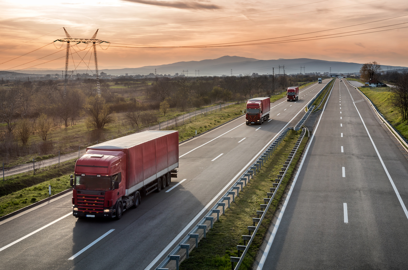 Trucks highway sunset